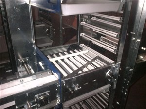 FDI Two Bar Lowerator egg collector at the end of a cage row